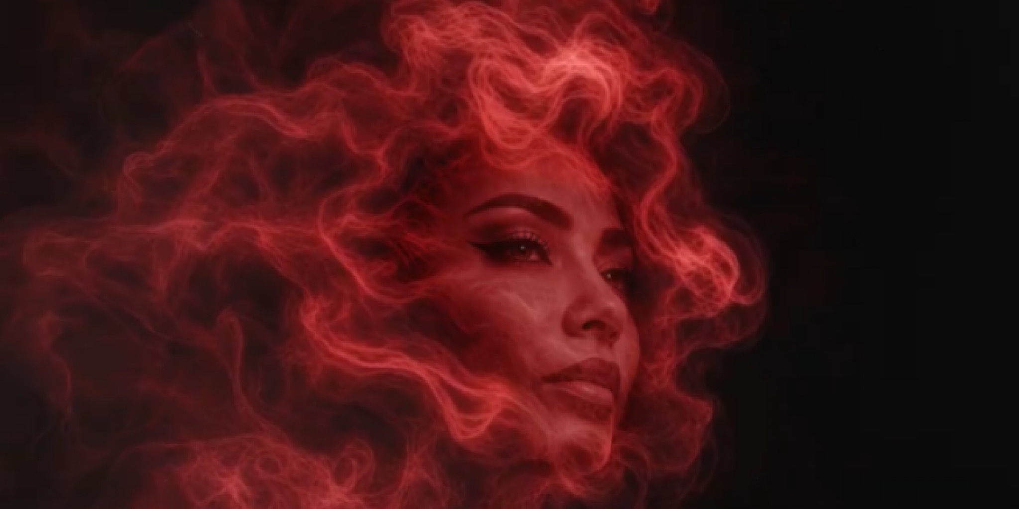 صورة فنية قريبة لوجه الفنانة شيرين عبد الوهاب، محاطة بهالة كثيفة من الدخان الأحمر الناري المتصاعد على خلفية سوداء.