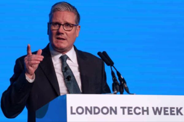 Sir Keir Starmer, UK Prime Minister, delivering an opening speech at the podium during London Tech Week 2025, with a blue background and the event logo prominently displayed.